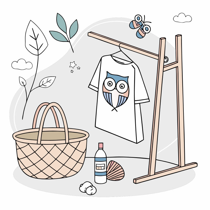 Eco-friendly owl-themed T-shirt displayed with natural decor, symbolizing sustainable living and wildlife-inspired style made in the USA.