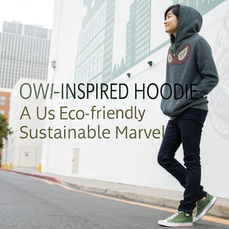 Model in dark heather owl hoodie styled with sneakers and mural wall. An eco-friendly hoodie redefining sustainable USA streetwear.